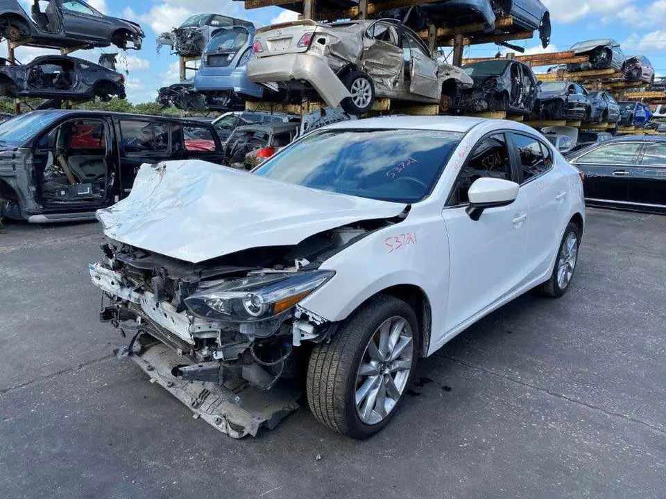 Mazda 3 and Mitsubishi Lancer at Melbourne scrap yard